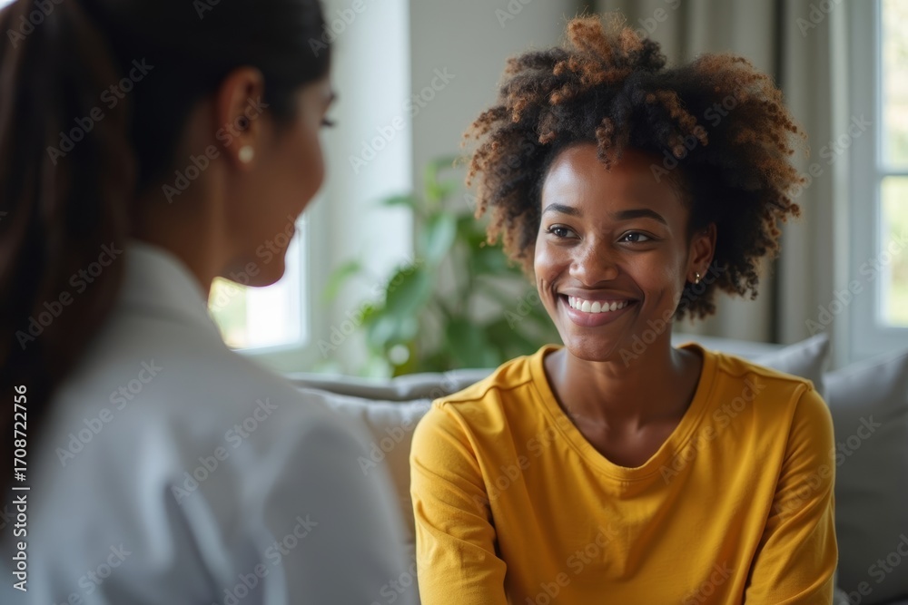 Fototapeta premium A young African woman receiving counseling and treatment for depression from a psychologist in the comfort of home