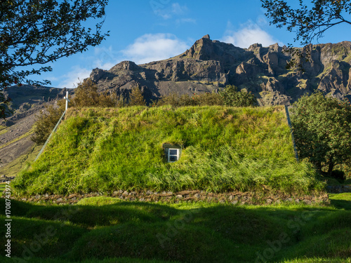 Green roof of traditional turf church in Hof, Iceland