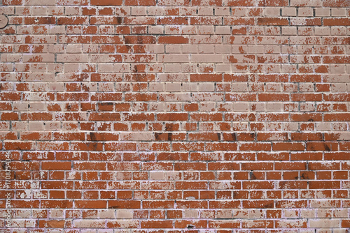 Brick wall painted pink white paint