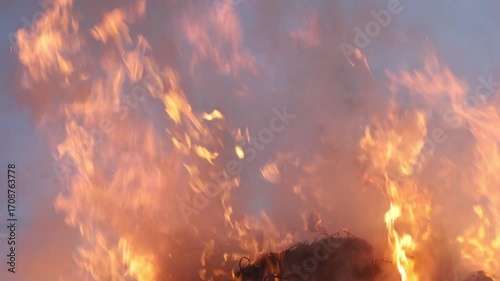 A bright flame emanating from burning trash