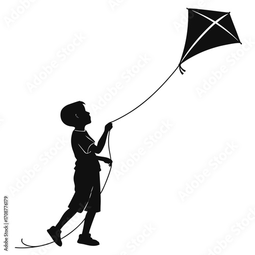 Boy standing near kite