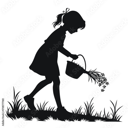 Girl collecting grass