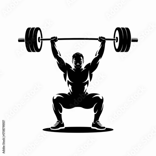 Silhouette of a muscular man performing a barbell overhead squat in a gym