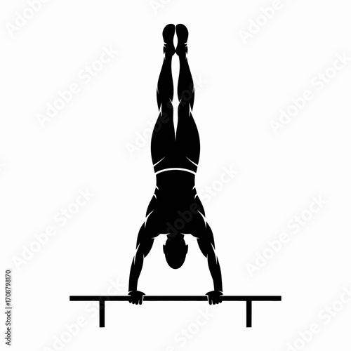 Silhouette of a man performing a handstand on parallel bars