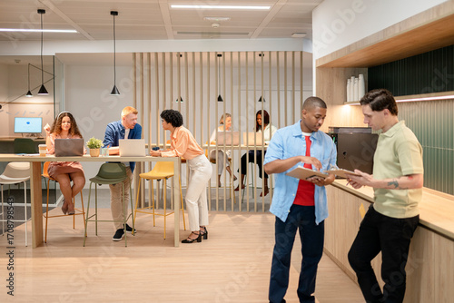 Multicultural business team collaborating in modern office