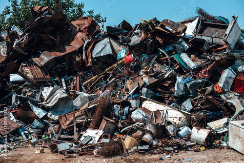 Pile of scrap metal in junkyard.