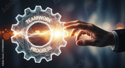 Business leader's hand engages glowing gear symbolizing teamwork and progress toward success