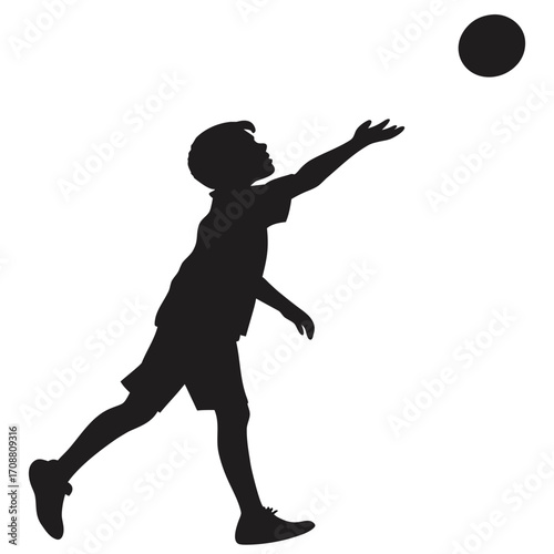 Boy tossing ball with one hand
