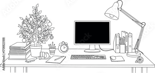 Cozy desk setup with computer, lamp, and festive plant for productive work or study