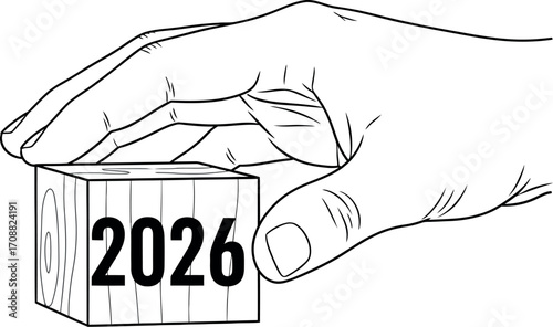 Hand carefully placing wooden block with year 2026, symbolizing future planning and strategy.