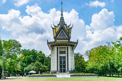 Khmer style stupa at the choeung ek genocidal center killing fields memorial holding the remains of victims of the khmer rouge regime, phnom penh, cambodia