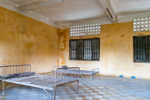 Tuol sleng genocide museum prison cell showing beds and barred windows
