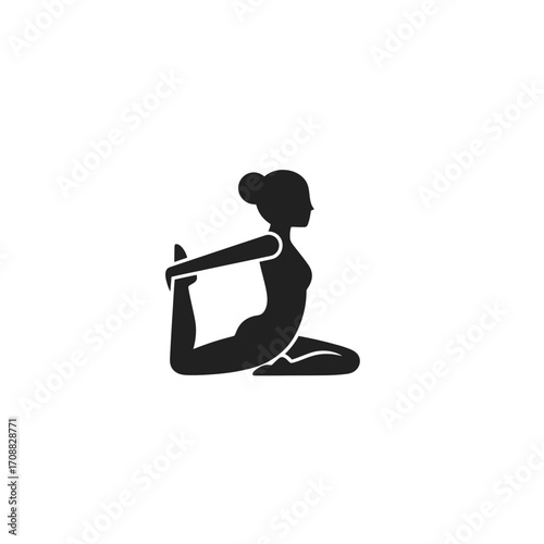 Yoga practitioner in pigeon pose demonstrating flexibility