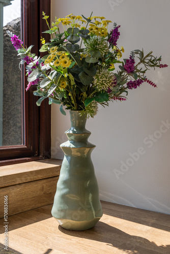 Flowers in Vase by Window