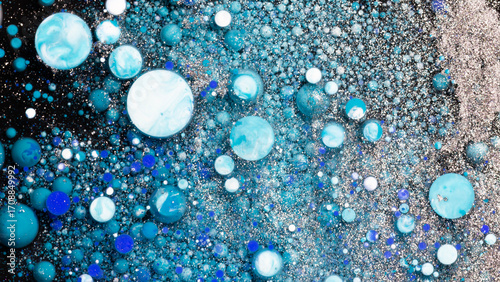 Abstract blue turquoise bubbles texture on dark background cosmic liquid art design