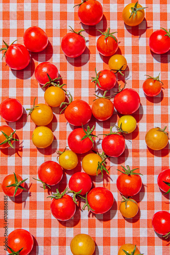 Cherry tomatoes on a checkered tablecloth