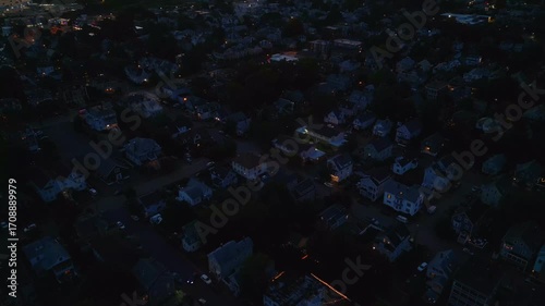 Aerial view of Salem Massachusetts at night with street lights turned on 
