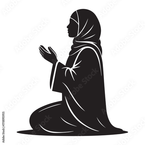 Silhouette of a muslim woman in hijab praying on her knees with hands raised in supplication and devotion