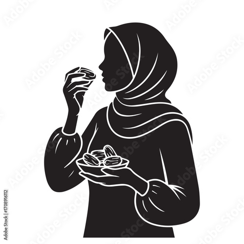 Silhouette of a muslim woman wearing a hijab holding a bowl of dates and eating one symbolizing ramadan and islamic tradition