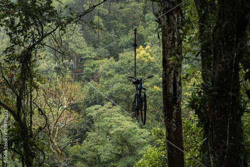 Adventure sky bike in rainforest of Monteverde Costa Rica