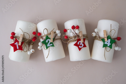DIY process of woman making Christmas arrangement of advent candle calendar four weeks. Series of handmade craft instruction. Zero waste eco-friendly winter holiday decoration. New year top view, flat