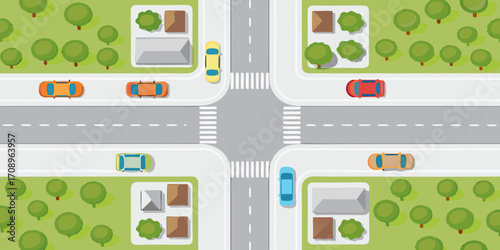 Top down view of a residential intersection with cars houses and trees