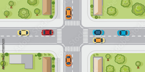 Aerial view of a busy intersection with cars crosswalks and trees creating a vibrant urban scene