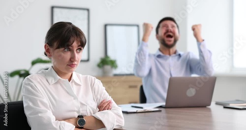 Woman feeling jealous of her colleague's success in office
