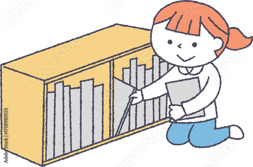 本棚の整理をする子供