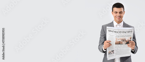 Young businessman reading n...