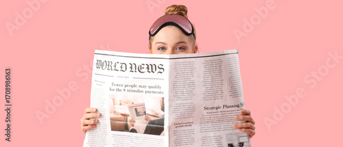 Young woman with newspaper ...