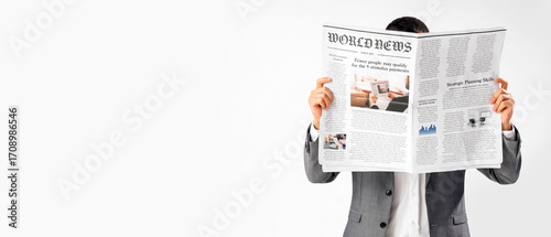 Young businessman reading n...