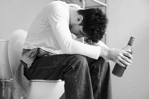 Drunk young man in restroom...