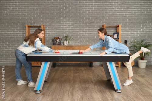 Young women playing air hoc...