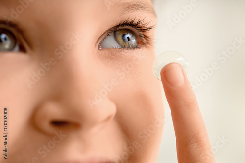 Cute little girl putting in...