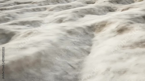 Abstract textured surface of light gray and white, rippled or wavy