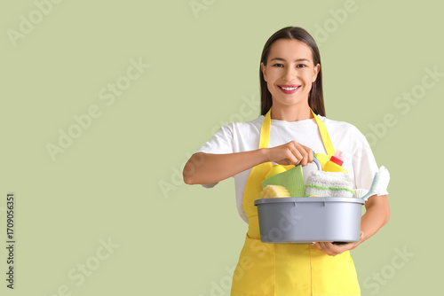 Female janitor with cleanin...