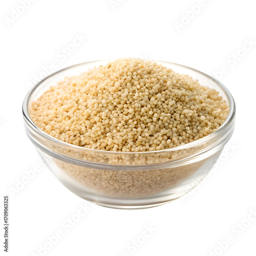 Small couscous grains piled high in a clear glass bowl on a white background pasta food