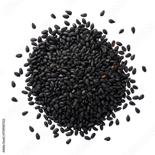 Dense pile of black sesame seeds on a black background heap