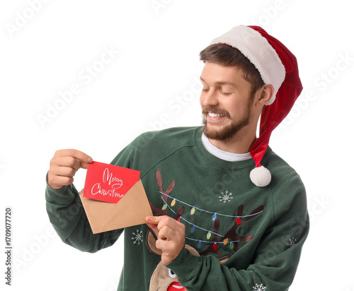 Happy young man in Santa ha...