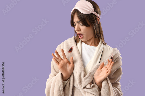 Scared young woman in pajam...