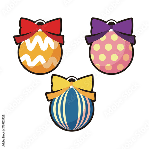 Three patterned ornament balls with bows are arranged side by side