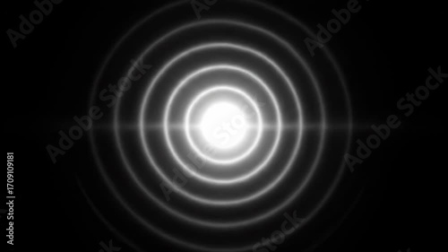 A seamlessly looping video showcases a minimalist black and white circular flare with concentric rings slowly rippling, forming an elegant abstract design optic, brilliance, science
