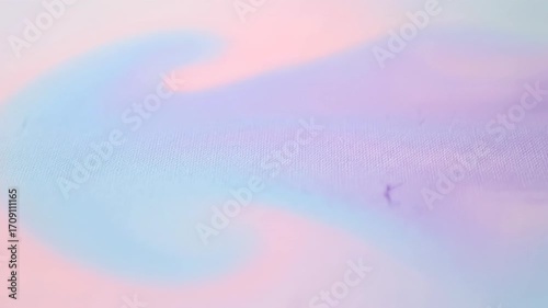A seamlessly looping video of a soft, diffused pastel light wash gently shifting and blending across an abstract canvas gentle, concept, spiritual