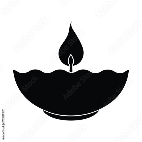 Silhouette of a diya oil lamp with a lit flame simple black icon for religious celebrations and festivals