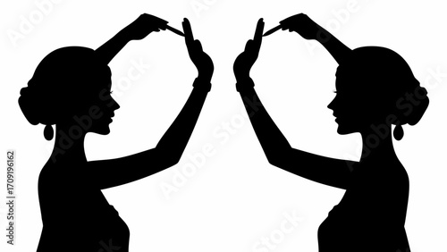 Two silhouettes of women holding pens above their heads in a mirrored pose against a white background