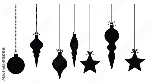 Black silhouette ornaments and stars hanging delicately from thin strings