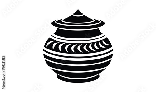 Traditional indian kalash pot with decorative bands and pointed lid