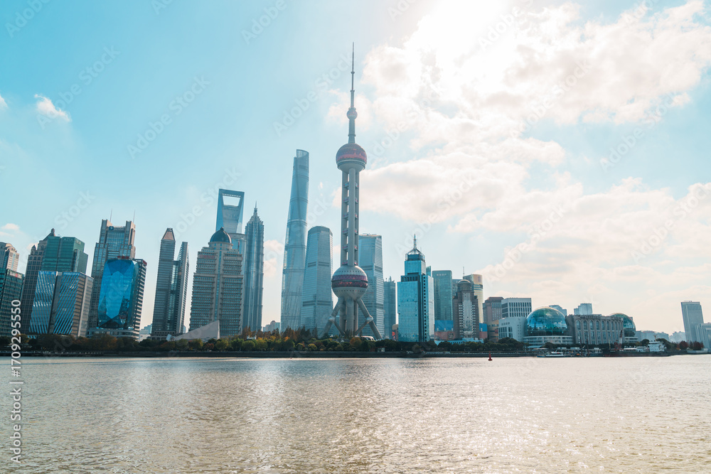 Obraz premium Cityscape view of Shanghai city in the morning. Skyscraper of Lujiazui in Pudong, view from The north Bund of Shanghai, China. landmark and popular for tourism attractions. Travel and Vacation concept