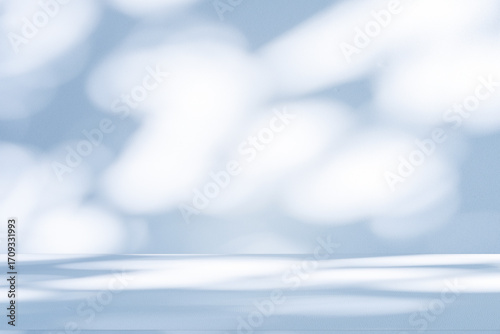 Wall interior background, studio and backdrops show products. with soft light shadow from window color blue and white. background for text insertion and presentation of product	

